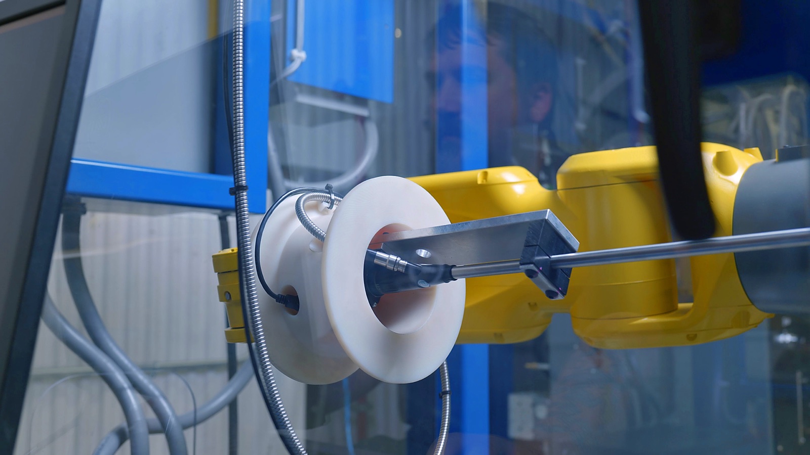 Robotic arm guiding a borescope probe into a propeller part for automated high definition inspection
